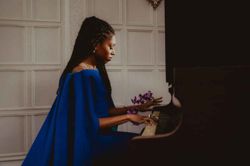 Isata Kanneh-Mason sat playing piano